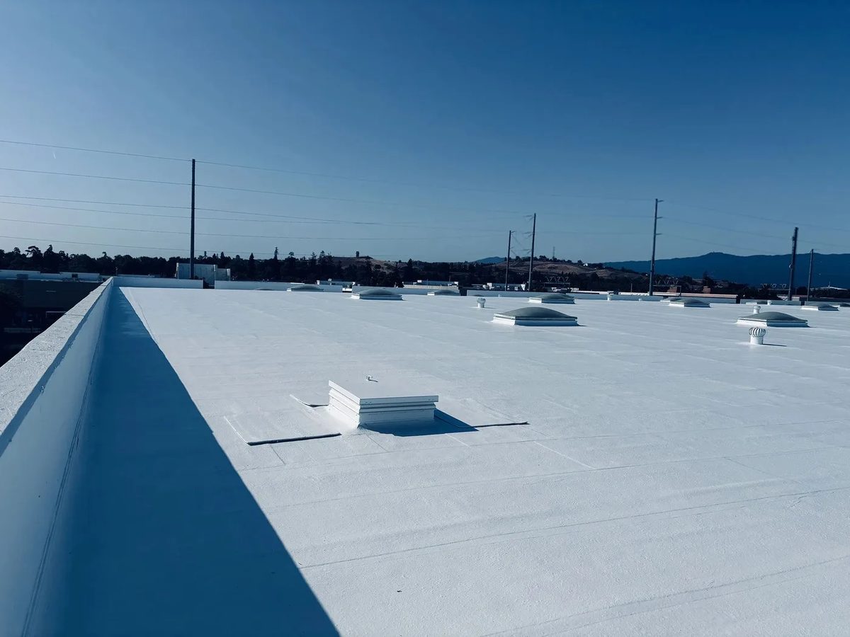 Finished white cool roof system on a commercial building in San Jose