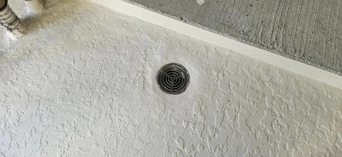 Commercial roof drainage correction and drain waterproofing repair