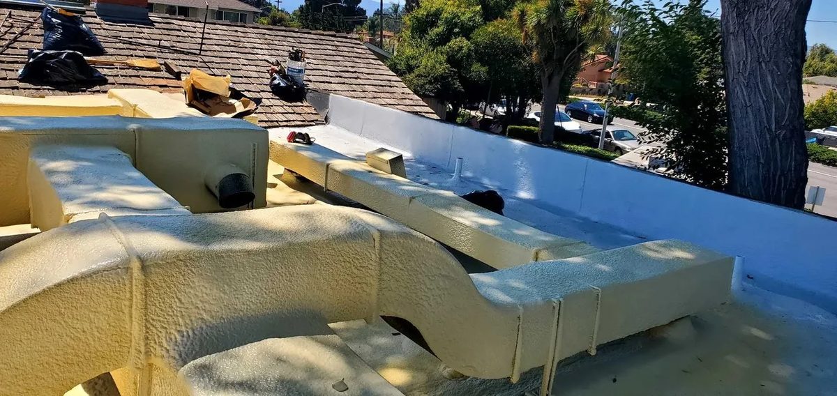 Rooftop HVAC equipment tie-in and waterproofing on a commercial roof